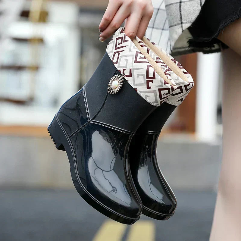 Serelina women's waterproof rain boots, featuring an intricate floral pattern and a sturdy, anti-slip treaded sole.