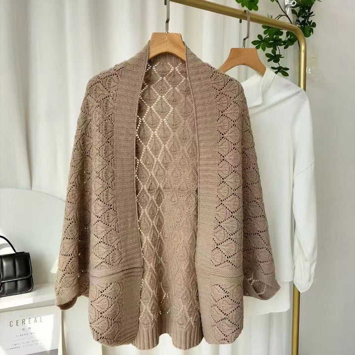 Detail shot of the soft knit fabric and diamond hollow texture of the short shawl cardigan.
