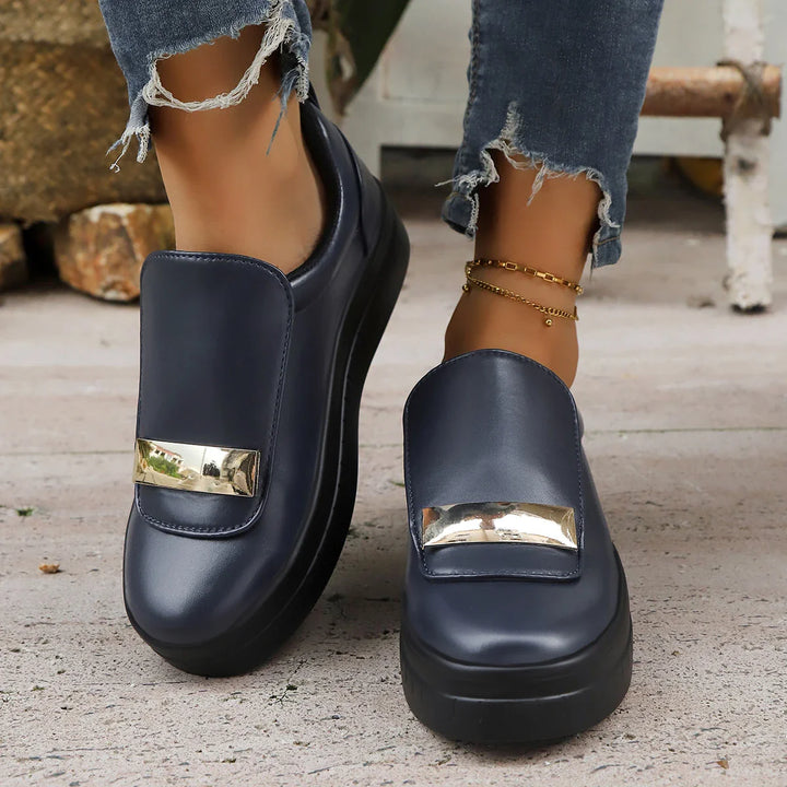 Back view of women's platform sneakers, highlighting the substantial elevated sole.