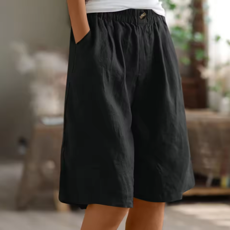 Side view of knee-length women's shorts, highlighting the wide leg and comfortable fit.