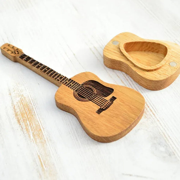 Guitar pick holder box holding several picks, organized and accessible.