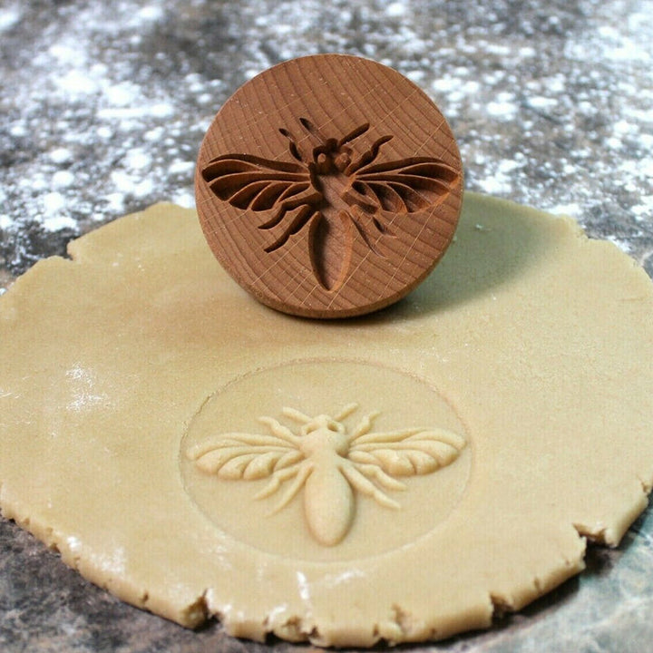 Traditional style wooden cookie press for creating intricately designed cookies